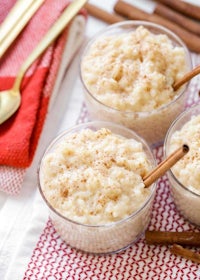 three bowls of oatmeal with cinnamon on a red napkin