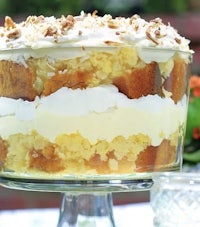 a trifle with whipped cream and pecans on top