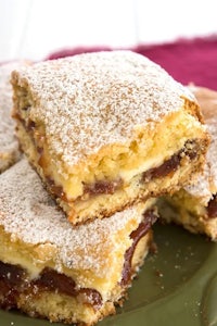 a plate with a stack of jam bars on it