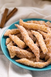 cinnamon sticks on a blue plate with cinnamon sticks